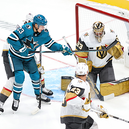 Sharks forward Oskar Lindblom (23) attempts to tip a shot past Golden Knights goalie Adin Hill (33)