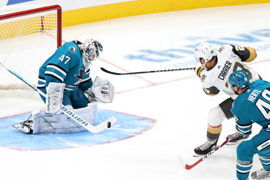 Sharks goalie James Reimer stops a shot by William Carrier (28)