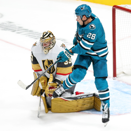 Timo Meier (28) tries to tip a shot past goalie Adin Hill