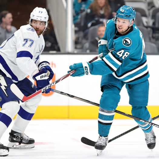 Tomas Hertl (48) takes a shot on goal in front of defenseman Victor Hedman (77)