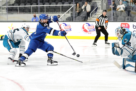 Artemi Kniazev (Left) breaks up a shot attempt by Callahan Burke (68) on Barracuda's goalie Eetu Makiniemi