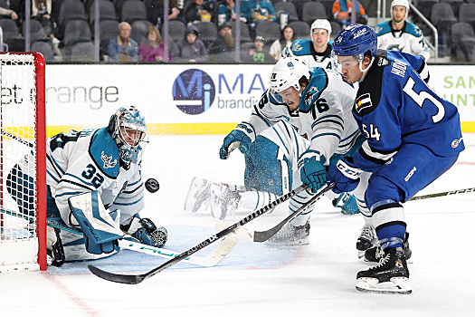 Barracuda's defenseman Luke Johnson (76) breaks up a shot attempt by Charles Hudson (54)