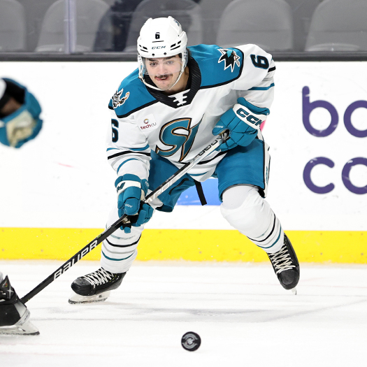 Barracuda's defenseman Ryan Merkley looks to control the puck after a faceoff