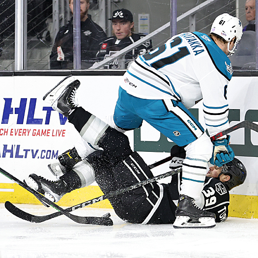 Barracuda's defenseman Santeri Hatakka (61) checks Alex Turcotte (39) into the boards