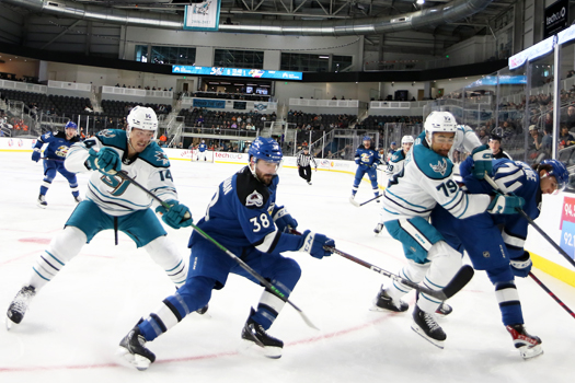 Jasper Weatherby (14) Spencer Smallman (38) Montana Onyebuchi (79) and Alex Beaucage (74) chase the puck into the corner
