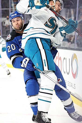 Justin Scott (20) checks Patrick Sieloff