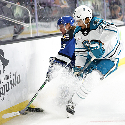 Ryan Wagner (13) and Montana Onyebuchi (79) fight for control of the puck