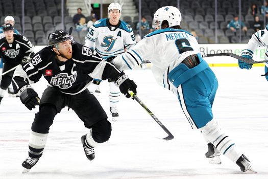 T.J. Tynan (17) tries to move around Barracuda's defenseman Ryan Merkley (6)