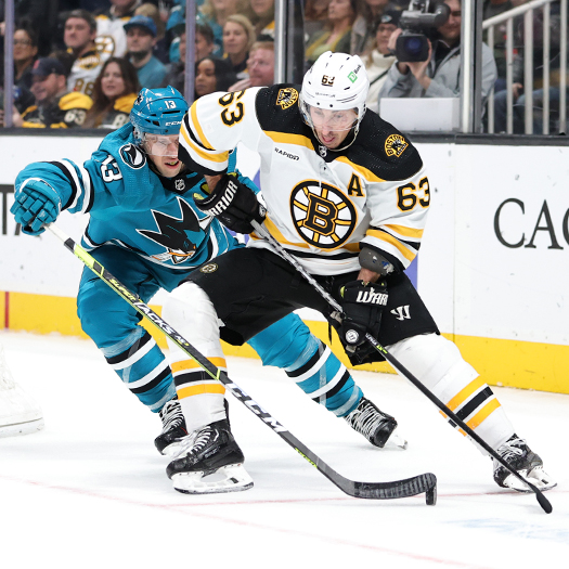 Nick Bonino (13) attempts to stick the puck away from Brad Marchand (63)