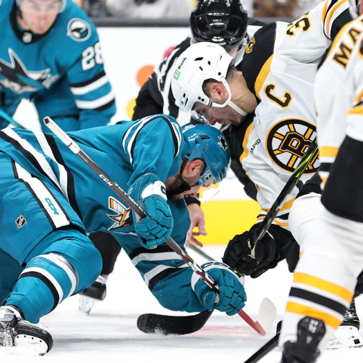 Tomas Hertl (Left) and Patrice Bergeron (37) fight for the puck