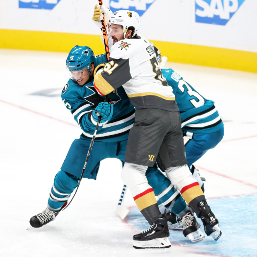 Mark Stone (61) battles Sharks defenseman Matt Benning (5) for position in front of the net