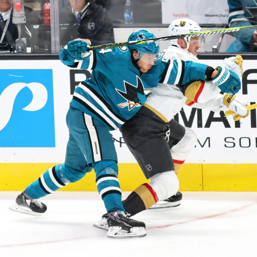 Mikael Granlund (64) checks Jack Eichel during first period action