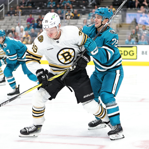 Morgan Geekie (39) and William Eklund (72) battle for the puck