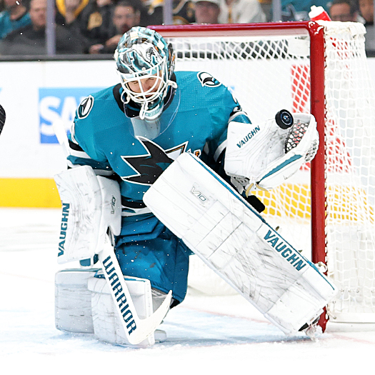 Sharks goalie Kaapo Kahkonen makes a glove save during first period action