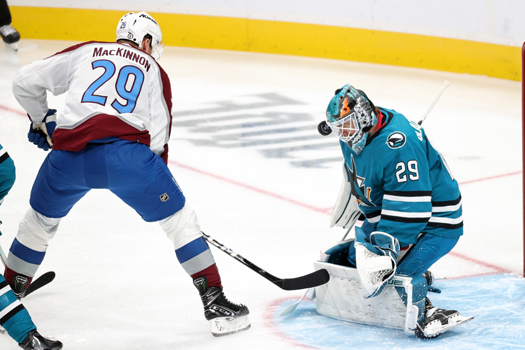 Sharks goalie Mackenzie Blackwood stops a shot by Nathan MacKinnon (29)