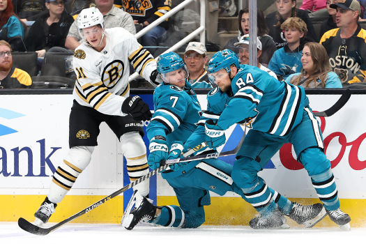 Trent Frederic (11) Nico Sturm and Jan Rutta (84) fight for the puck along the boards