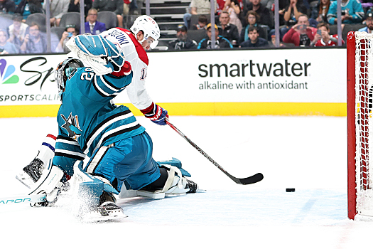 Canadians center Nick Suzuki scores a shoot-out goal past Sharks goalie Mackenzie Blackwood
