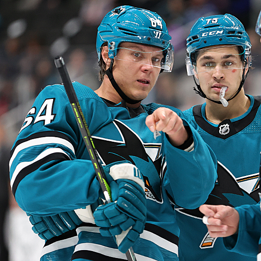 Mikael Granlund (84) gives instructions to Danil Gushchin (75) prior to a face-off during a second period Sharks power play