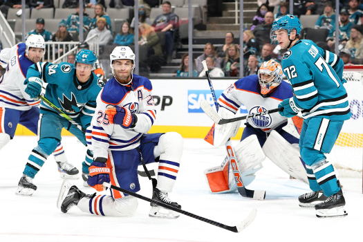 Oilers defenseman Darnell Nurse (25) gets in position to block a shot as Sharks Mikael Granlund (64) and William Eklund (72) look for a rebound