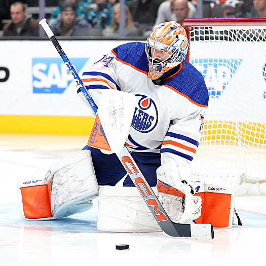 Oilers goalie Stuart Skinner stops a long clearing shot