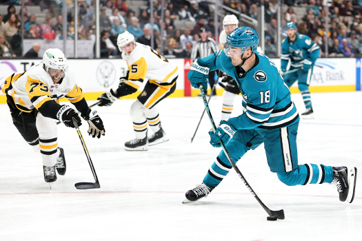 Penguins defenseman Pierre-Olivier Joseph (73) attempts to block a shot by Sharks forward Filip Zadina (18)
