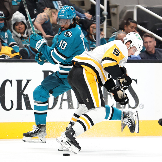 Sharks forward Anthony Duclair (10) deeks around Penguins defenseman Ryan Shea (5)