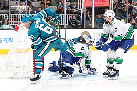 Sharks forward Mikael Granlund (64) scores a goal past Canucks goalie Casey DeSmith twenty two seconds into the third period