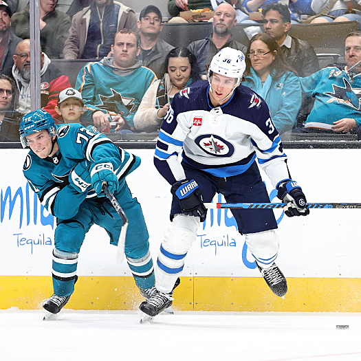 Jets forward Morgan Barron (36) steals the puck away from William Eklund (72)