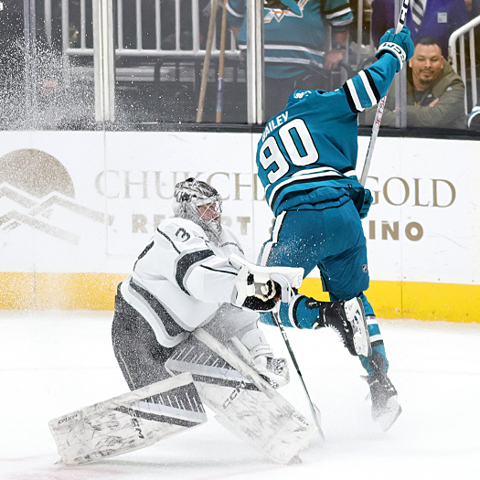 Justin Bailey (90) attempts to avoid a collision with Kings goalie David Rittich as he cases the puck during a Sharks penalty kill