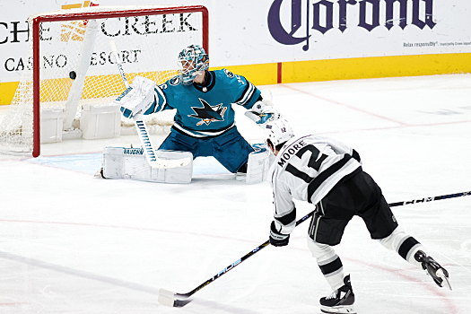 Kings forward Trevor Moore (12) scores a goal past Sharks goalie Kaapo Kahkonen during second period action
