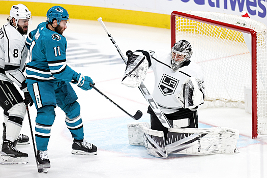 Kings goalie David Rittich makes a blocker save as Luke Kunin (11) looks for a rebound