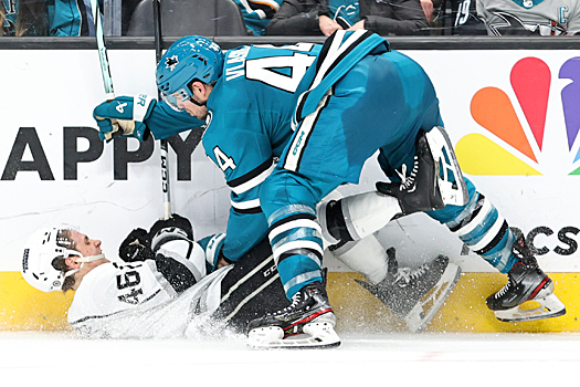 Sharks defenseman Marc-Edouard Vlassic (44) checks Blake Lizotte (46) to the ice