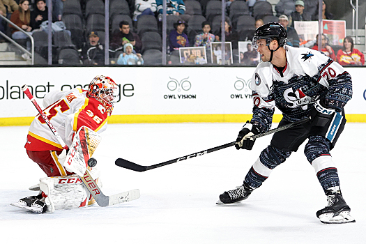 Wranglers goalie Oscar Dansk (35) blocks a breakaway shot attempt by Brandon Coe (70)