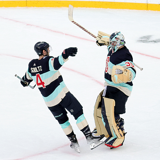 Kraken goalie Joey Daccord celebrates his shutout win with Justin Schultz (4)