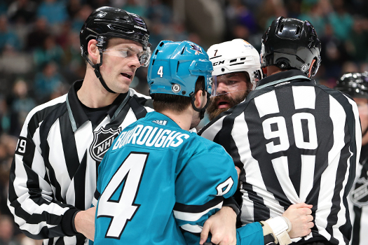 Kyle Burroughs (4) and Radko Gudas (7) exchange works as linesmen Joe Mahon (89) and Travis Toomey (90) attempt to separate them