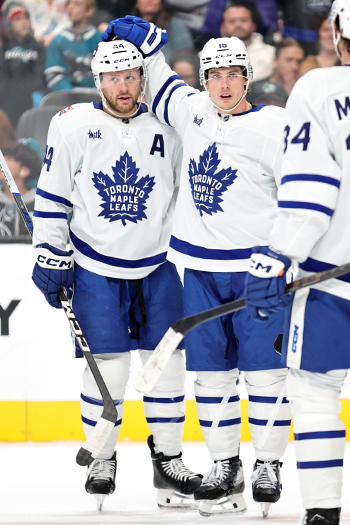 Mitchell Marner ( right) celebrates his first period goal with Morgan Rielly