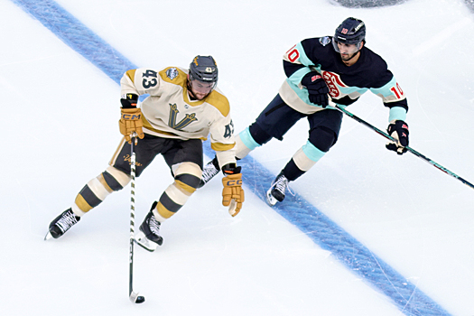 Paul Cotter (37) attempts to move past Matty Beniers (10)