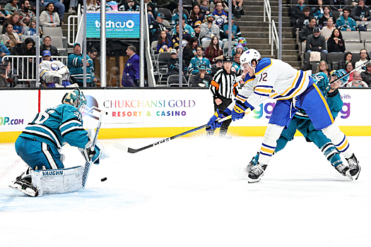 Sabres center Tage Thompson (72) takes a shot on Sharks goalie Kaapo Kahkonen as defenseman Marc-Edouard Vlassic (44) attempts to contain him
