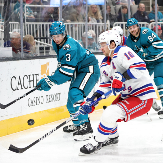 Sharks defenseman Henry Thrun (3) flips the puck away from Rangers forward Artemi Panarin (10)