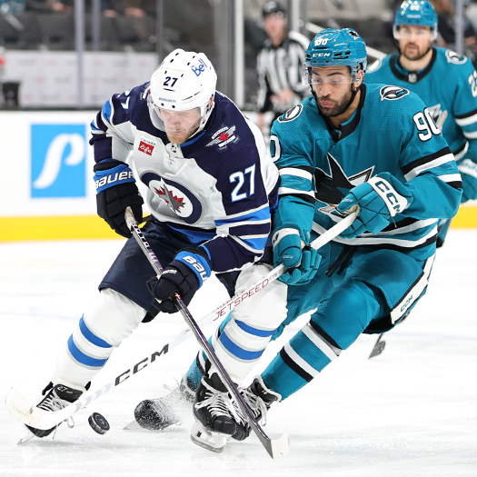 Sharks forward Justin Bailey (90) knocks the puck away from Nikolaj Ehlers (27)