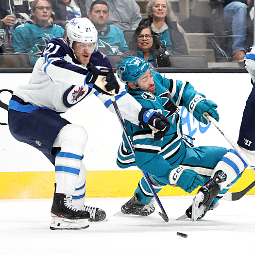Sharks forward Justin Bailey (90) looses his balance as he attempts to move around Dominic Toninato (21)