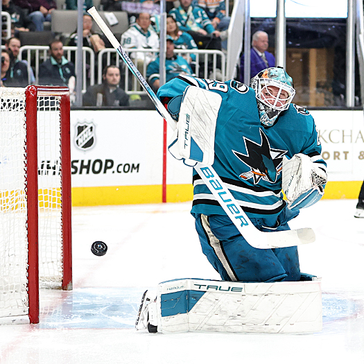 Sharks goalie Mackenzie Blackwood fights off a shot for one on his 32 saves in route to a 2-0 shutout win