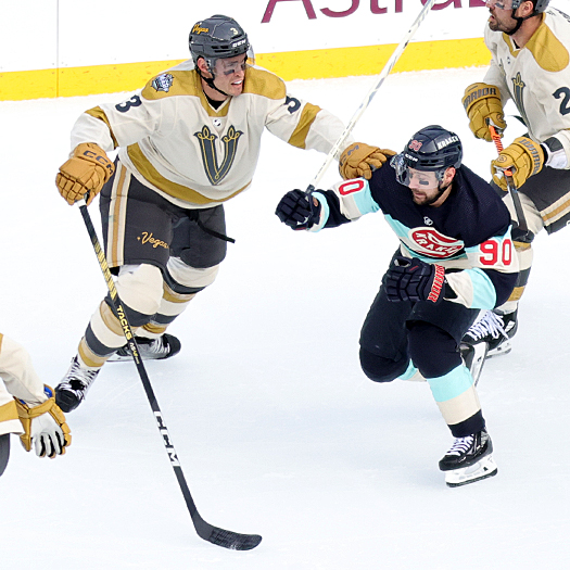 Tomas Tatar (90) attempts to move past Golden Knight defenseman Brayden McNabb (3)