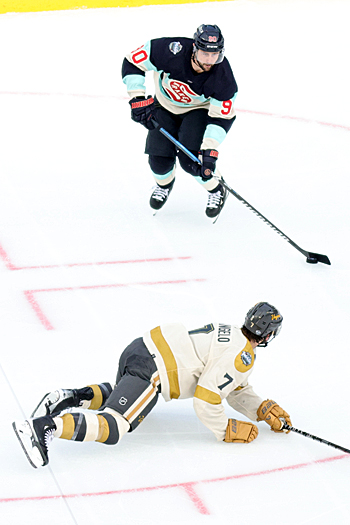 Tomas Tatar (90) looks to pass the puck as Alex Pietrangelo (7) dives to block the passing lane
