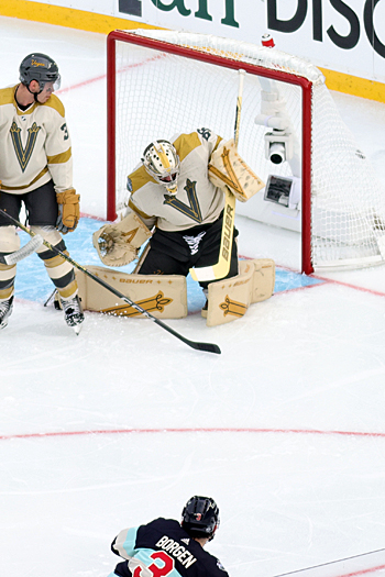 Will Borgan (3) fires a shot past Golden Knight goalie Logan Thompson for the Kraken's second goal