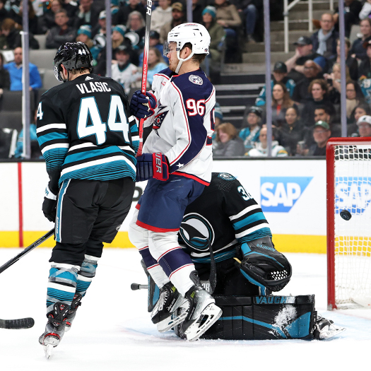 Jack Roslovic (96) screens Sharks goalie Kaapo Kahkonen as Zach Werenski's (not pictured) shot finds the net for the Blue Jackets first goal