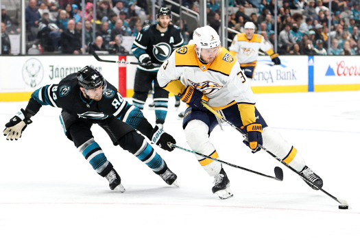 Sharks defenseman Jan Rutta (84) reaches for the puck as Jeremy Lauzon (3) moves in on net