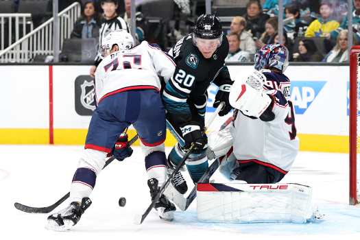 Sharks forward Fabian Zetterlund (20) collides with goalie Elvis Merzlikins as defenseman Jake Bean (22) attempts to provide support