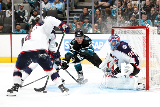 Sharks forward Fabian Zetterlund (20) reaches for a rebound as Blue Jackets defenseman Cole Sillinger (4) attempts to control the puck