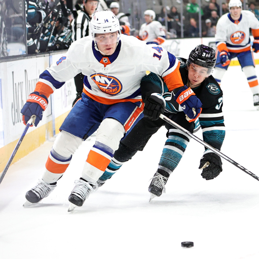 Islanders forward Bo Horvat (14) moves the puck past defenseman Henry Thrun (3)